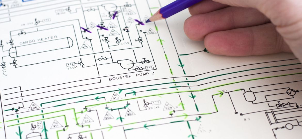 Engineer working with technical diagram of a gas storage facility.